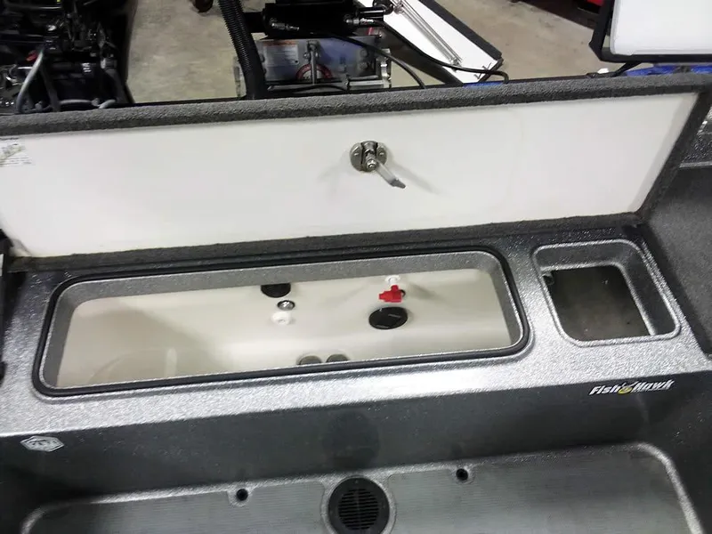 Slide: The Image of 2018 Ranger 621FS Fisherman boat livewell and storage compartment, featuring a sleek design. - 33