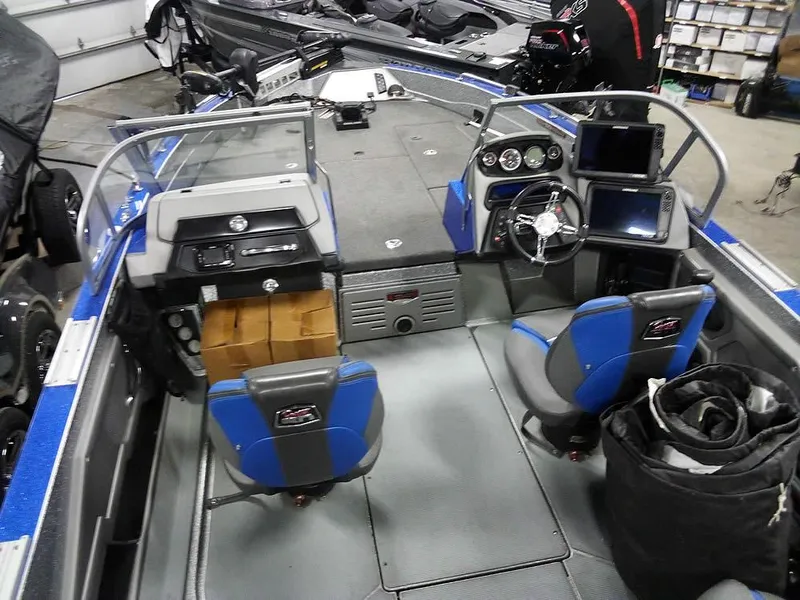 Slide: The Image of 2018 Ranger 621FS Fisherman boat interior with dual seats and control panel. - 5