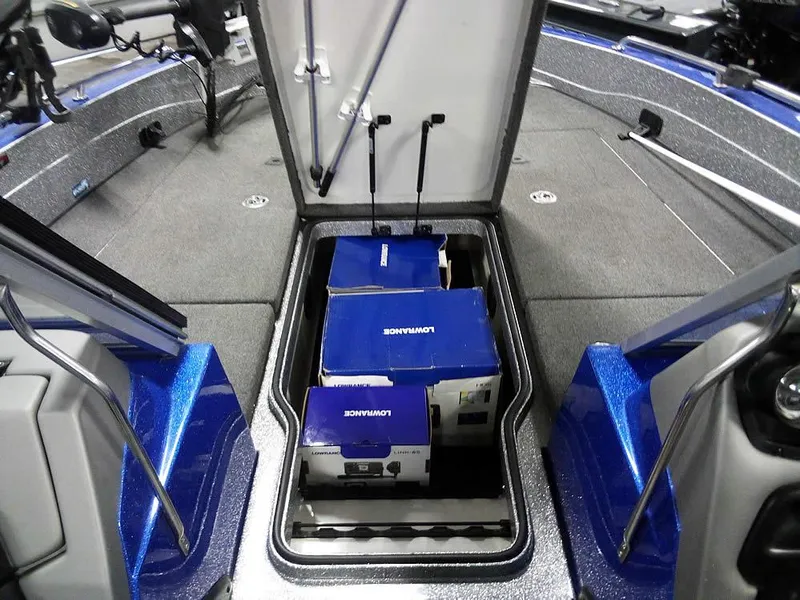 Slide: The Image of 2018 Ranger 621FS Fisherman boat storage compartment with equipment boxes inside. - 7