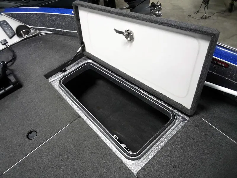 Slide: The Image of 2018 Ranger 621FS Fisherman boat storage compartment with open lid, showcasing interior space. - 9