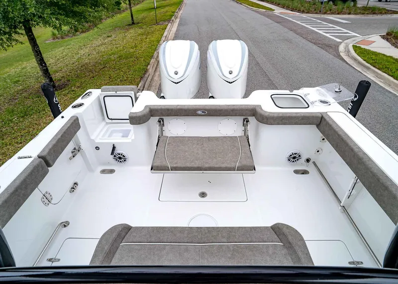 Slide: The Image of 2025 Sea Hunt Gamefish 30 CB boat interior with seating and dual engines. - 10