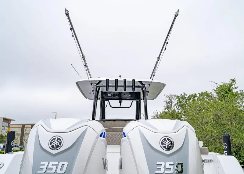 Slide: The Image of 2025 Sea Hunt Gamefish 30 CB with dual Yamaha 350 engines, viewed from the rear. - 11