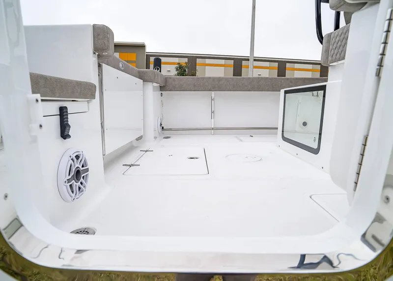 Slide: The Image of 2025 Sea Hunt Gamefish 30 CB boat interior with seating and storage compartments. - 12