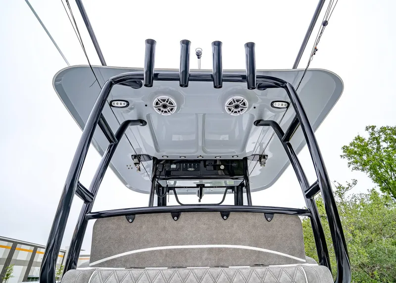 Slide: The Image of 2025 Sea Hunt Gamefish 30 CB boat, featuring a sleek T-top and rod holders. - 14