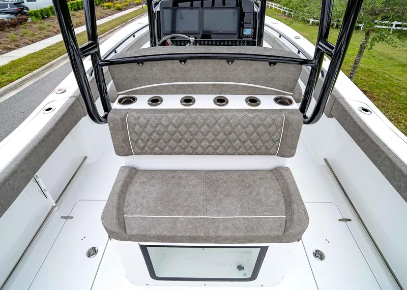 Slide: The Image of 2025 Sea Hunt Gamefish 30 CB boat interior with cushioned seating and cup holders. - 15