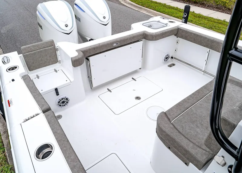 Slide: The Image of 2025 Sea Hunt Gamefish 30 CB boat interior with seating and storage compartments. - 16