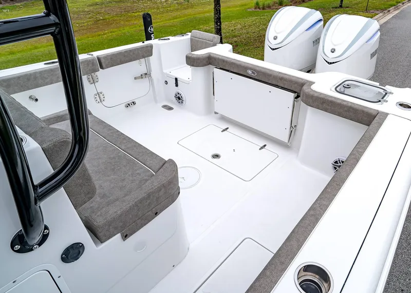Slide: The Image of 2025 Sea Hunt Gamefish 30 CB boat interior with seating and dual engines. - 17