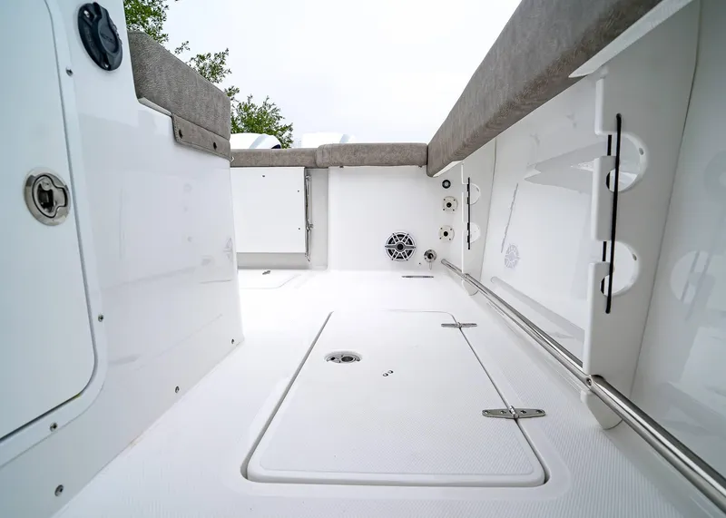 Slide: The Image of 2025 Sea Hunt Gamefish 30 CB boat interior, featuring sleek white deck and cushioned seating. - 18