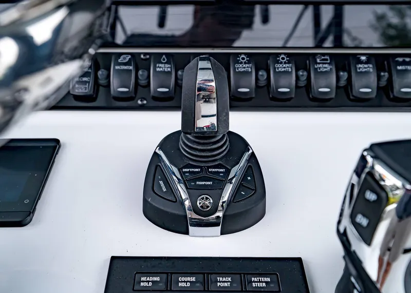 Slide: The Image of Control panel of 2025 Sea Hunt Gamefish 30 CB boat with joystick and switches. - 28
