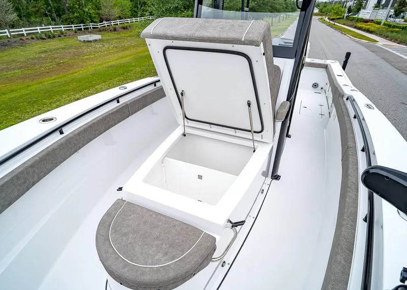 Slide: The Image of 2025 Sea Hunt Gamefish 30 CB boat with open storage compartment on deck. - 38