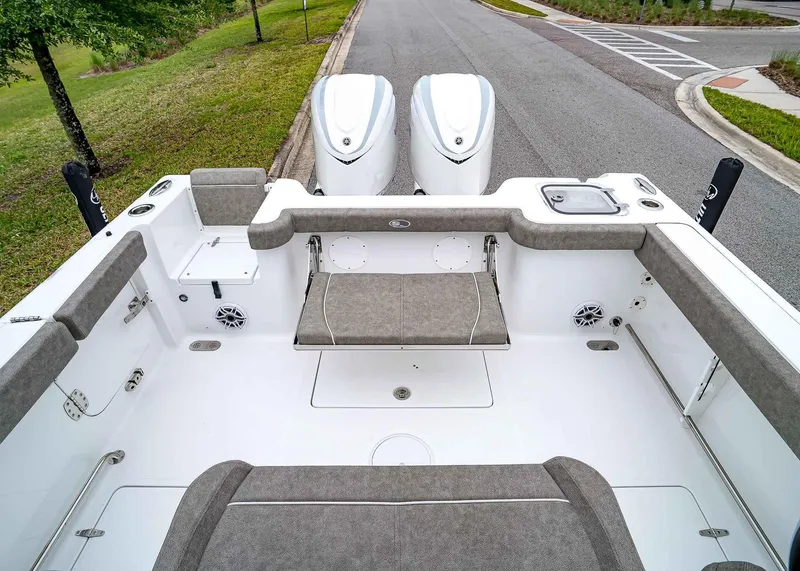 Slide: The Image of 2025 Sea Hunt Gamefish 30 CB boat interior with dual engines and cushioned seating. - 8