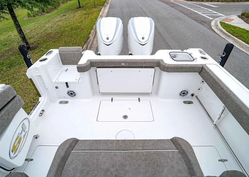 Slide: The Image of 2025 Sea Hunt Gamefish 30 CB boat deck with dual engines and seating. - 9