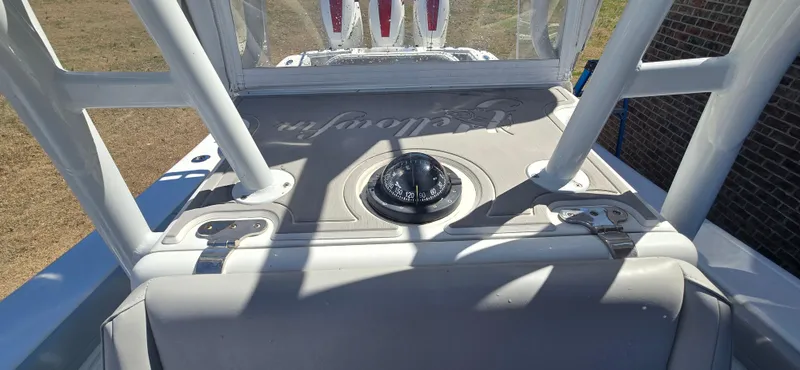 Slide: The Image of 2017 Yellowfin 36 boat console with compass and sturdy framework. - 10