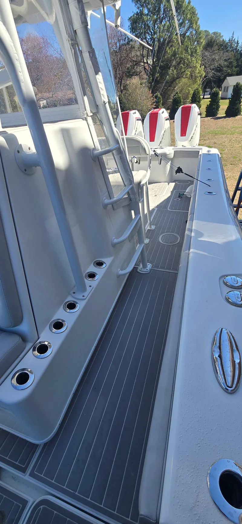 Slide: The Image of 2017 Yellowfin 36 boat deck with rod holders and seating. - 16