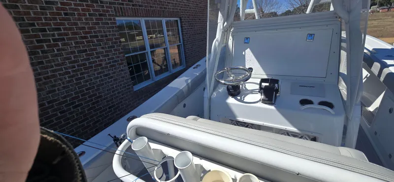 Slide: The Image of 2017 Yellowfin 36 boat interior with steering wheel and rod holders. - 4