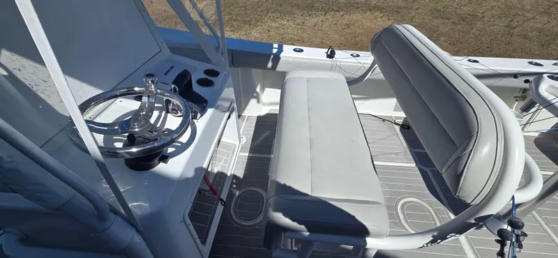 Slide: The Image of 2017 Yellowfin 36 boat interior with steering wheel and seating area. - 5