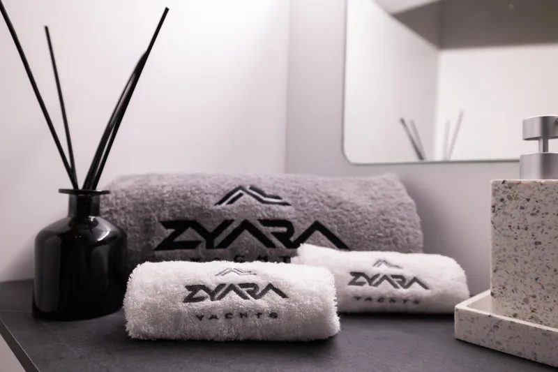 Slide: The Image of Luxurious bathroom setup with ZYARA 44 branded towels and elegant decor, 2025. - 17