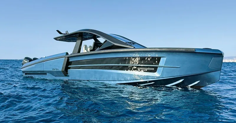Slide: The Image of Luxury yacht ZYARA 44, 2025 model, cruising on clear blue ocean waters. - 0