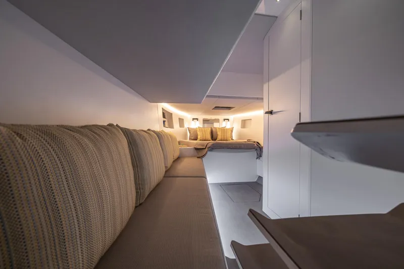 Slide: The Image of Modern interior of Introductory ZYARA 44 yacht, 2025 model, featuring cozy seating and ambient lighting. - 15