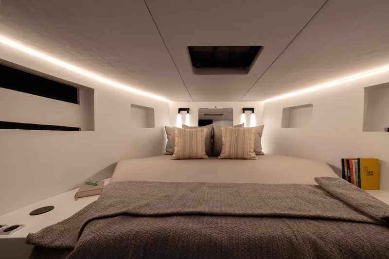 Slide: The Image of Luxurious interior of 2025 Introductory ZYARA 44 yacht with cozy bedding and ambient lighting. - 23