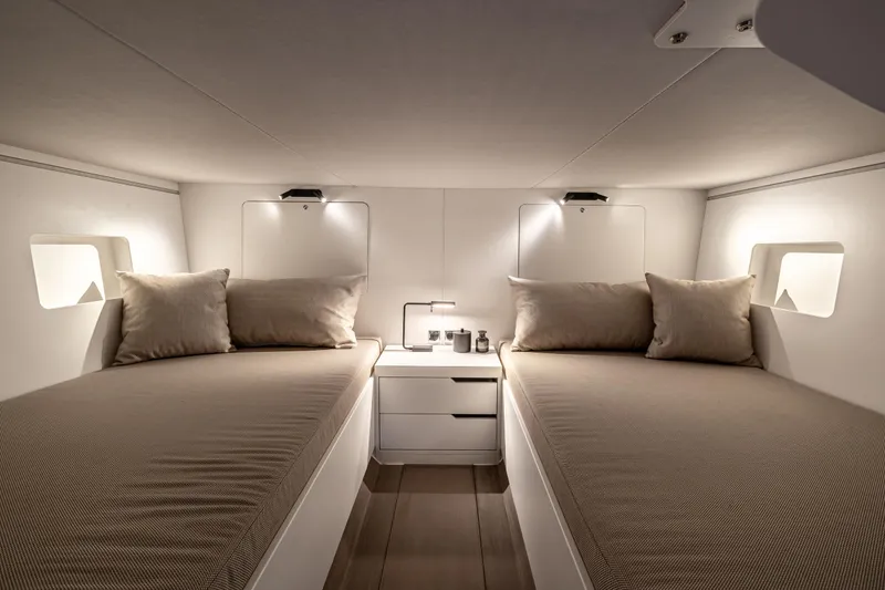 Slide: The Image of Luxurious twin cabin interior of Introductory ZYARA 44 yacht, 2025 model, with modern lighting. - 24