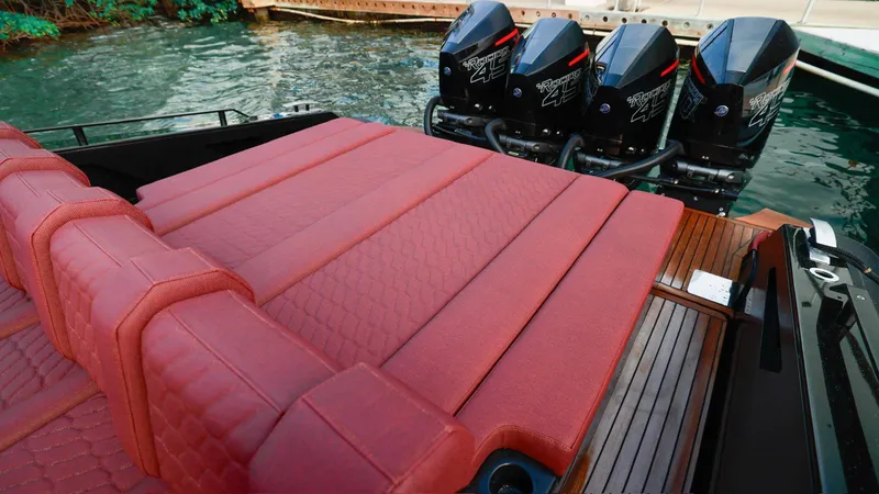 Slide: The Image of Red cushioned seating on Skipper-BSK 42 boat, 2023 model, with powerful outboard engines. - 12