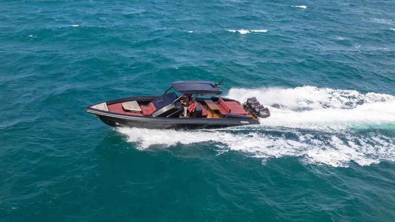 Slide: The Image of Skipper-BSK 42 boat cruising on open sea, 2023 model, sleek design. - 21