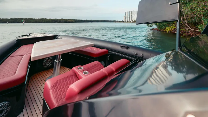 Slide: The Image of Luxurious 2023 Skipper-BSK 42 boat interior with red seating and scenic water view. - 27