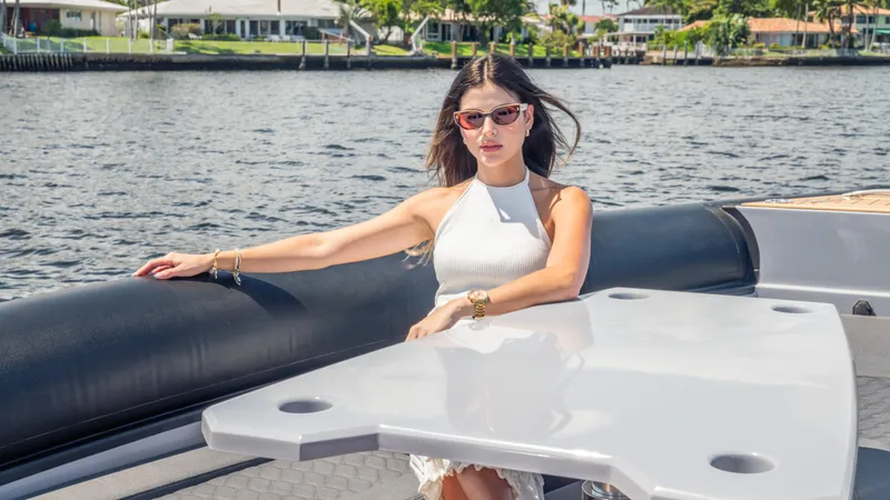 Slide: The Image of Woman relaxing on a 2025 Skipper 38 boat, enjoying a sunny day on the water. - 18