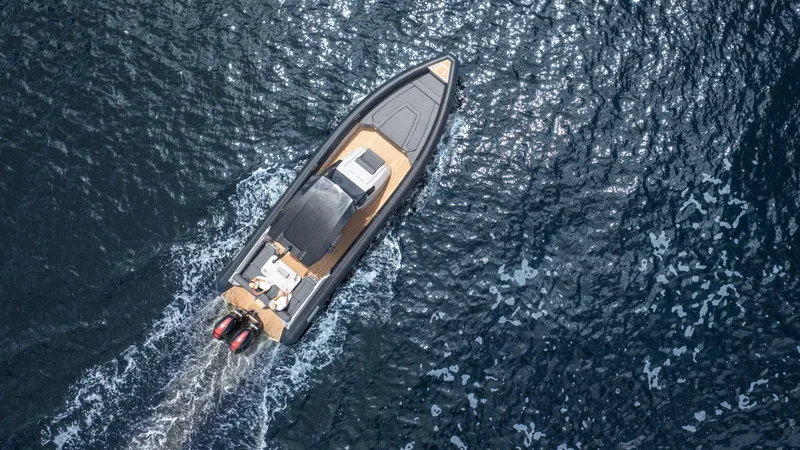 Slide: The Image of Aerial view of 2025 Skipper 38 boat cruising on open water. - 35