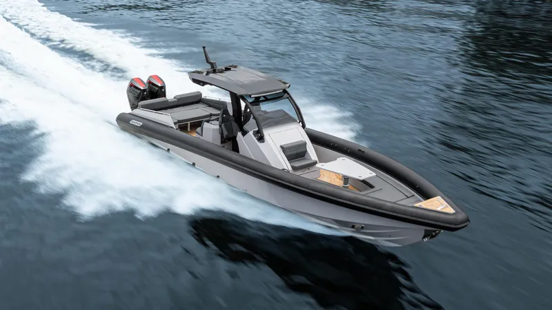 Slide: The Image of 2025 Skipper 38 boat cruising on water with dual engines. - 38