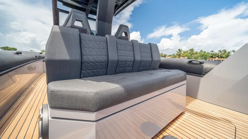 Slide: The Image of Luxurious seating on 2025 Skipper 38 boat with sleek design and wooden deck. - 26