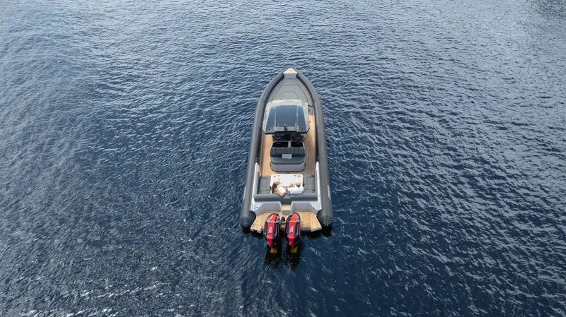 Slide: The Image of Skipper 38 boat, 2025 model, on calm water, aerial view. - 33