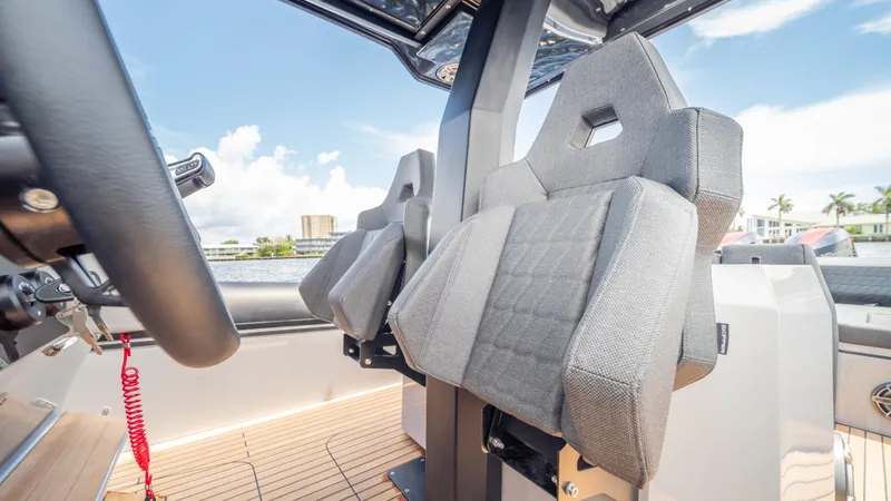 Slide: The Image of Interior of 2025 Skipper 38 boat with modern seating and steering wheel. - 15