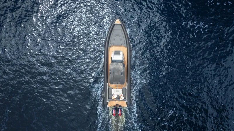 Slide: The Image of Aerial view of 2025 Skipper 38 boat cruising on open water. - 35