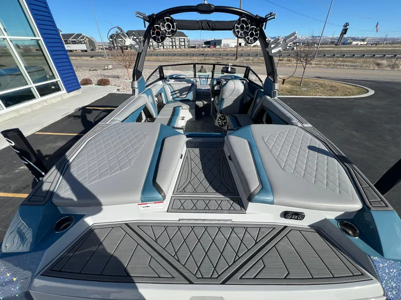 Slide: The Image of 2018 Tigé RZX3 boat interior with sleek seating and modern design features. - 12