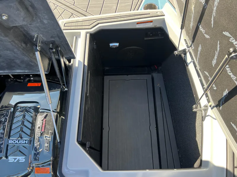 Slide: The Image of 2018 Tigé RZX3 boat engine compartment with Raptor 575 engine. - 24