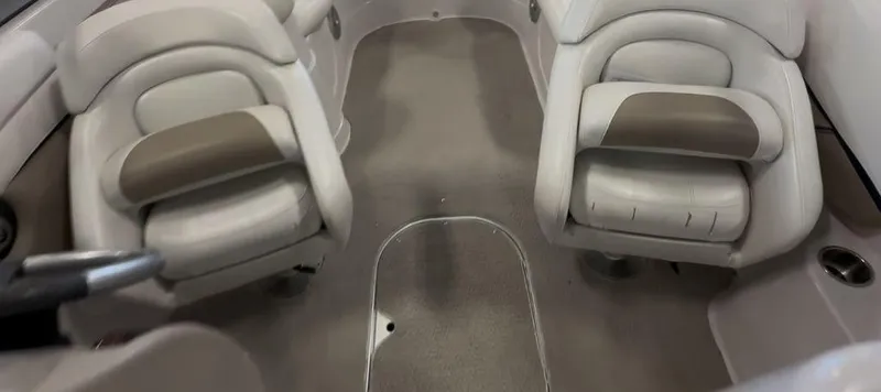 Slide: The Image of Interior of a 2006 Four Winns 260 Horizon boat with two cushioned seats. - 10