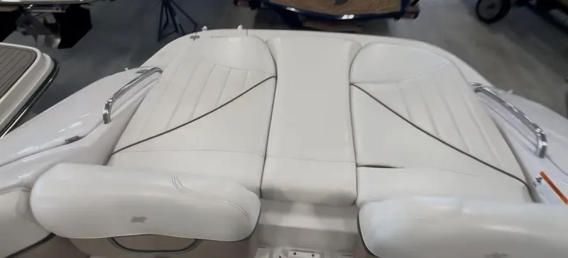 Slide: The Image of 2006 Four Winns 260 Horizon boat with white leather seating and chrome accents. - 12