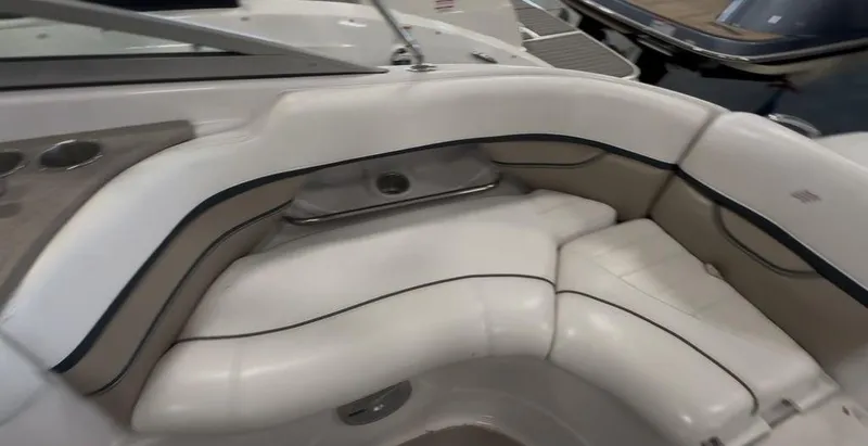Slide: The Image of 2006 Four Winns 260 Horizon boat interior with white cushioned seating. - 5