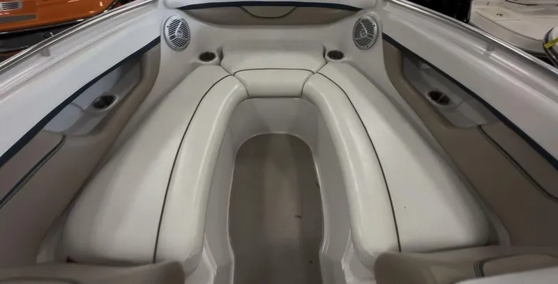 Slide: The Image of 2006 Four Winns 260 Horizon boat interior with white seating and built-in speakers. - 7