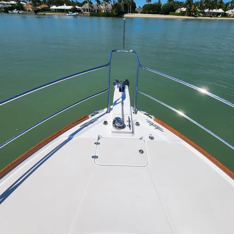 Slide: The Image of Bow view of 2009 Sabre 34 Express yacht on calm water. - 12