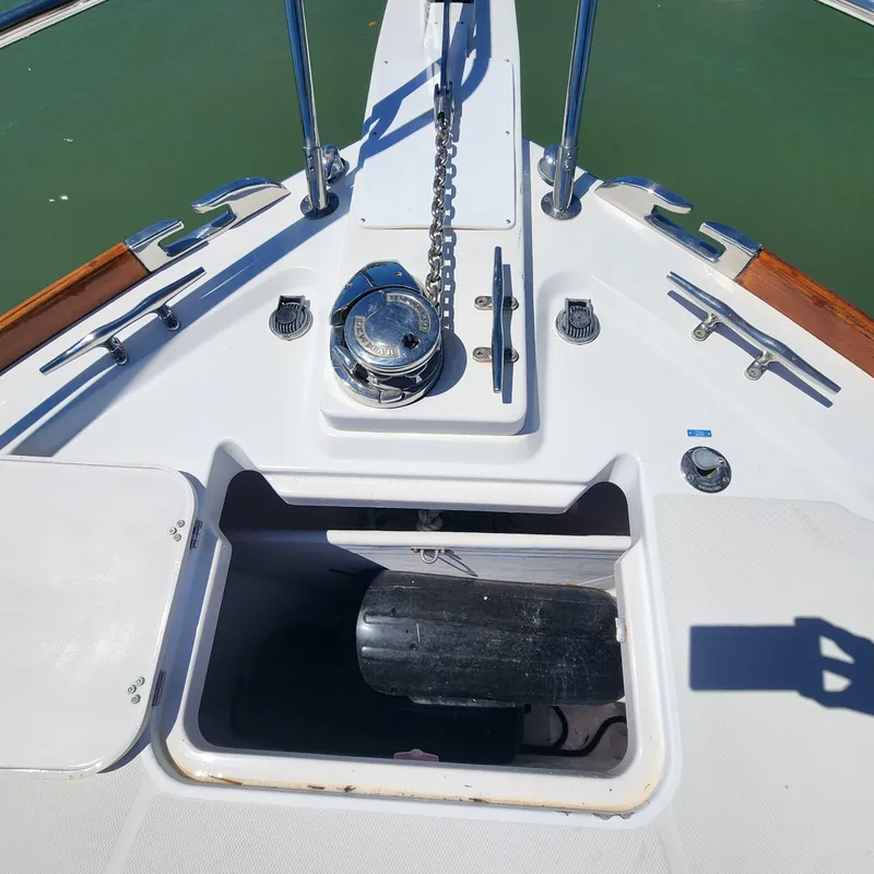 Slide: The Image of Bow of 2009 Sabre 34 Express boat with anchor chain and storage compartment. - 14