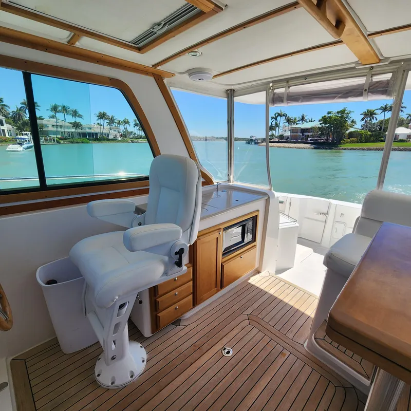 Slide: The Image of Interior of 2009 Sabre 34 Express boat with scenic waterfront view. - 21