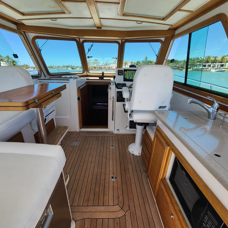Slide: The Image of Interior of 2009 Sabre 34 Express yacht with wooden flooring and modern amenities. - 27
