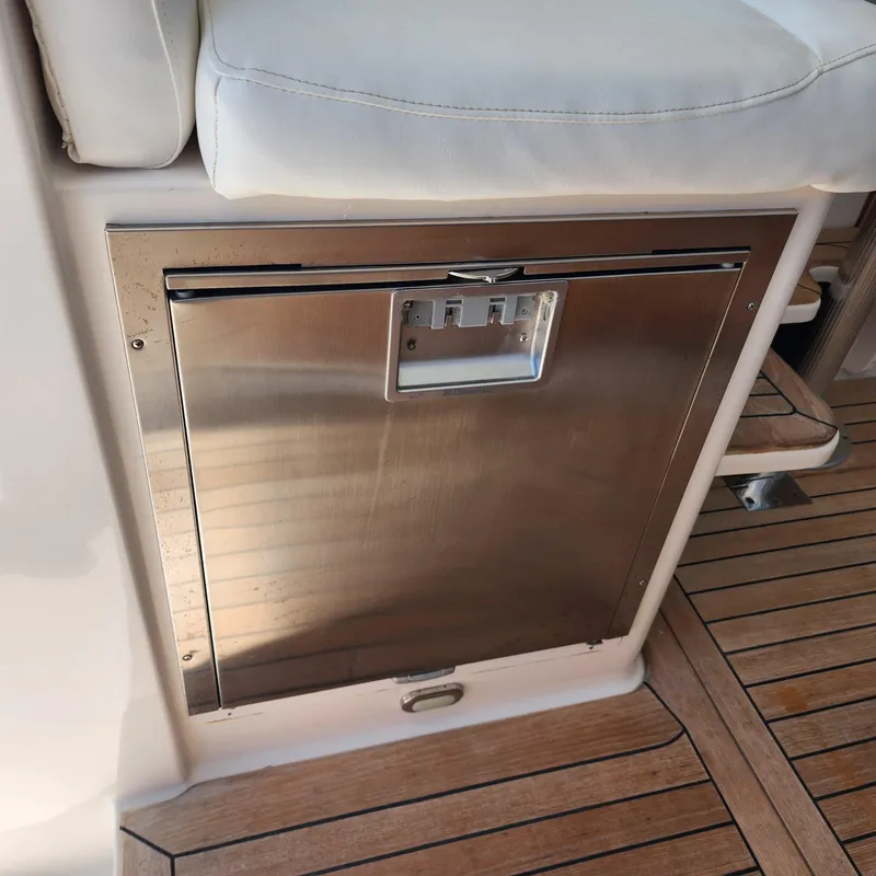 Slide: The Image of Stainless steel compartment on 2009 Sabre 34 Express boat with teak flooring. - 33