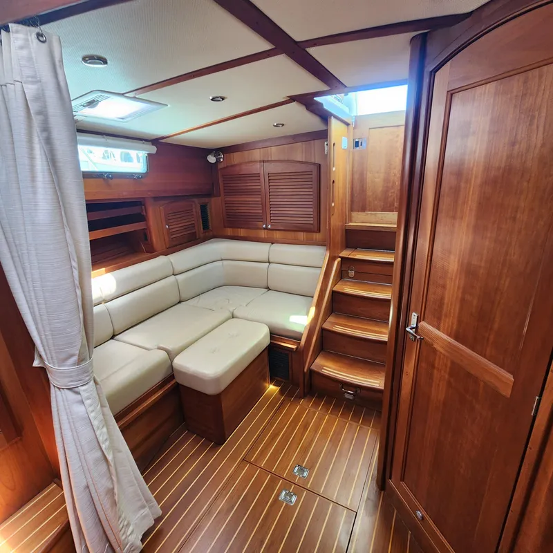 Slide: The Image of 2009 Sabre 34 Express yacht interior with wooden finish and beige seating. - 40