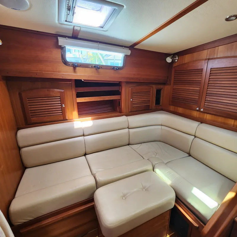 Slide: The Image of Interior of 2009 Sabre 34 Express yacht with beige leather seating and wooden cabinetry. - 44