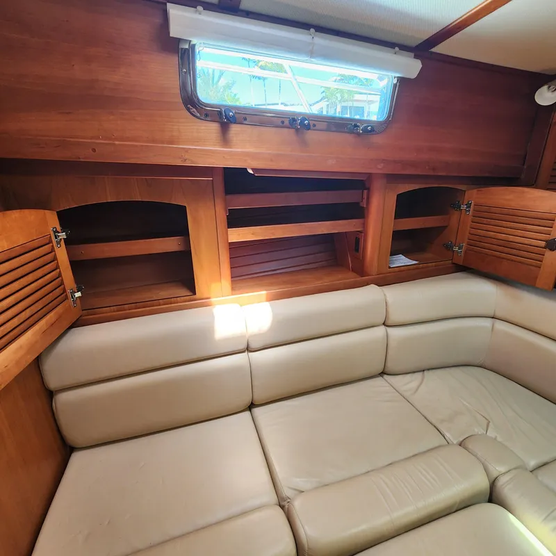 Slide: The Image of 2009 Sabre 34 Express interior with beige seating and wooden cabinetry. - 45