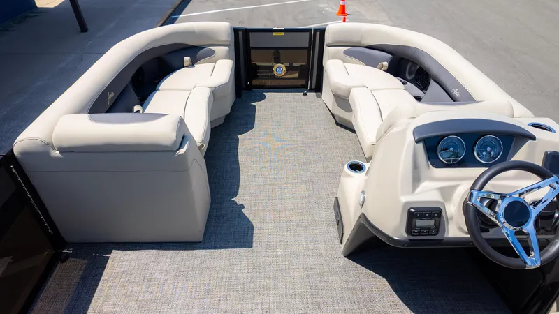 Slide: The Image of 2024 Barletta ARIA 22UC pontoon boat interior with plush seating and modern dashboard. - 11